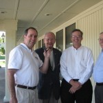 All smiles at the Score grand Opening of Score as Bob Connell does a live broadcast break