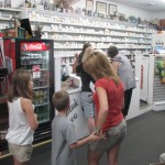 Folk line up to sign up at Mark's Pharmacy