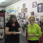 Laura Hilton, Author and Horseshoe Bend resident signs copies of her book