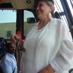 Aunt Minnie talks with a bus load of folks