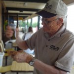 Fred has to check Rich's work by tast testing a Petit Jean Hot Dog